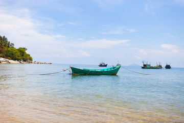 Naklejka na ściany i meble Fishing boats at bay in Hon Son Island, Kien Giang, Vietnam