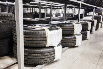 Fototapeta na wymiar Tires are stored on shelves