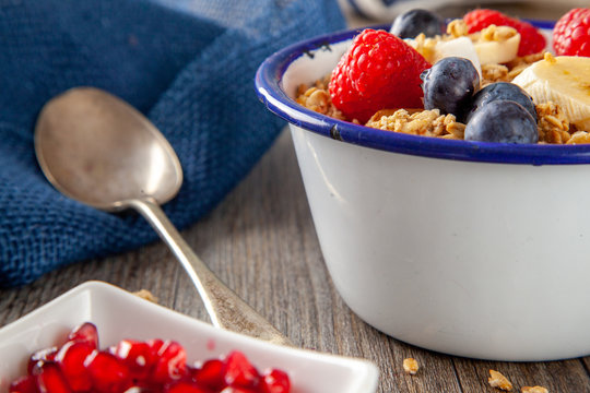 Granola and Berry Breakfast bowl with spoon
