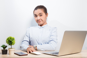 Woman show disgust when she look at laptop