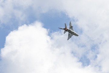 Naklejka na ściany i meble Military fighter jet in flyby