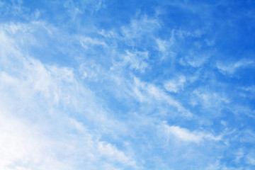 White feather clouds in bright azure sky (background)