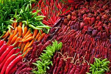 Fototapeta premium Heap Of Ripe Big Red Peppers At A Street Market In thailand