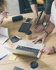 Concept of presentation new business project.Male hands pointing to screen modern laptop.Teamwork process in coworking office.Vertical.