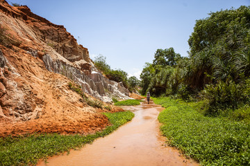 PHAN THIET, BINH THUAN, VIETNAM, May 7th, 2018: Fairy Stream Canyon Red river between rocks and jungle Mui Ne Vietnam. Red canyon near Mui Ne, southern Vietnam