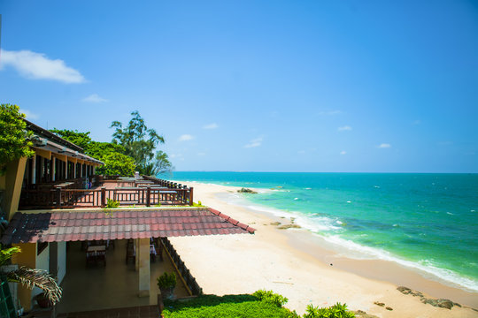 Beautiful beach with blue sky and coconut in Mui Ne, Binh Thuan province, Vietnam