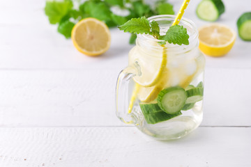 Infused Water With Lemon Cucumber and Mint on Wooden Background Detox Water Copy Space Lemonad