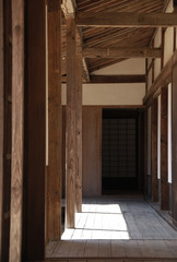 Obraz na płótnie Canvas a roofed (covered) passage in old japanese house / 旧日本家屋の渡り廊下(縁側)