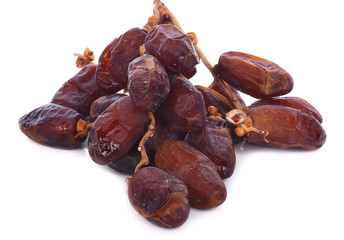 Delicious fresh organic dates over white background