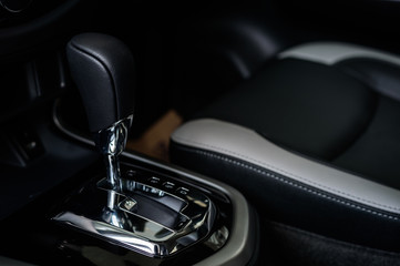 closeup automatic gear in new car with soft-focus and over light in the background