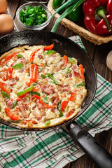 Fresh omelette with bacon and bell pepper