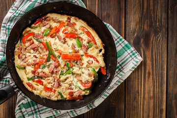 Fresh omelette with bacon and bell pepper