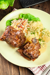 Pork spare ribs served with mashed potatoes and sauce