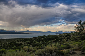 Threatening storm clouds are hanging low over mono lake, near the town of Lee Vining, in the Sierra Nevada mountain range. Sierra Nevadas, Eastern California, USA.