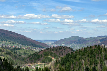 Small village in the Carpathian mountains in a valley surrounded by forests. Soft focus. Beautiful plan.