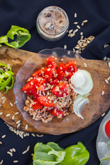 Fresh salad with buckwheat, tomatoes, and onion. Healthy diet. Lunch or dinner. Raw vegan vegetarian food