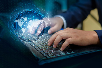 Press enter button on the computer. business logistics Communication network World map send message Connect worldwide hand keyboard Communications network map of the world Blue map Dark blue backgroun