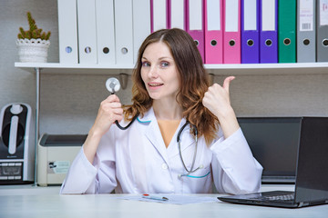 Portrait of a female doctor in office with an endoscope