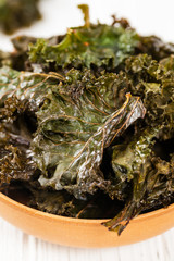 Baked Crispy Kale Chips. Selective focus.