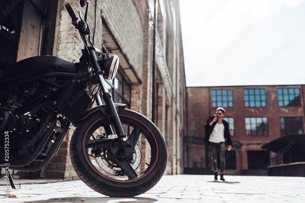 Wall mural Biker with modern motorcycle