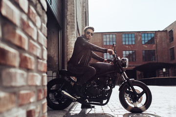 Fototapeta na wymiar Biker with modern motorcycle
