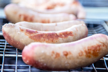 Assorted delicious grilled meat with vegetables over the coals on a barbecue