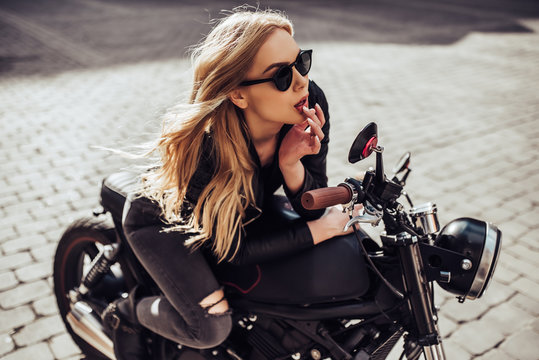 Woman with black motorcycle