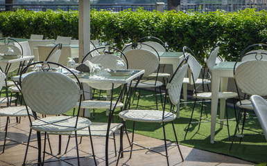 Chairs and tables of a restaurant seating outside