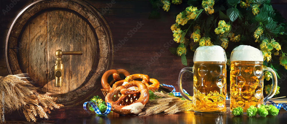 Wall mural oktoberfest beer barrel and beer glasses with soft pretzels, wheat and hop