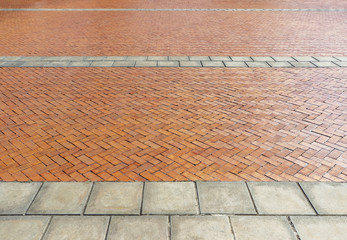 Red brick paving stones on a sidewalk