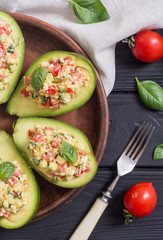 Avocado stuffed with cucumber , tomatoes and eggs