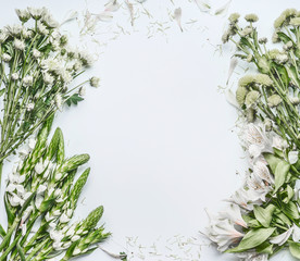 Beautiful floral frame layout with green flowers for bouquet making on white background, top view