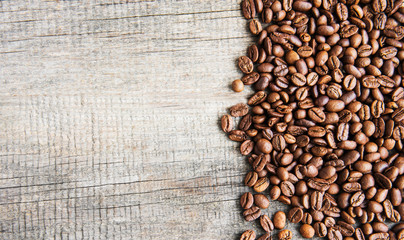 Coffee beans on wooden background