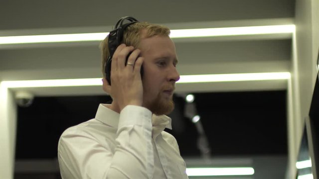 man in headphones at the Museum of Modern Art
