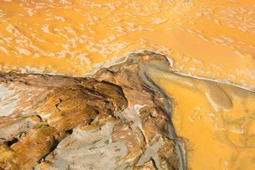 The peculiar color of the water and stones of the river Odiel, near the mines of Riotinto, in the province of Huelva, Spain