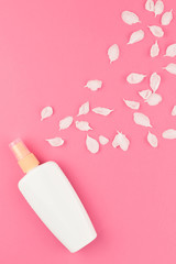 Sunscreen blank bottle mockup with petals
