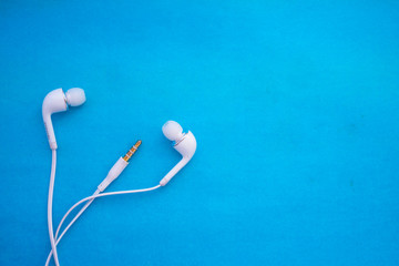headphones on a blue background
