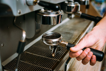 coffee brewing process. professional barista preparing a cup of fresh aromatic invigorating hot drink