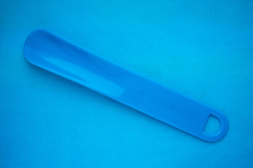 shoehorn on a blue background