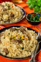 Pilaf style rice and lamb with carrots and garlic