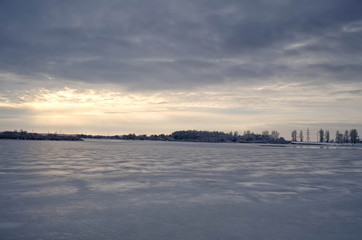 frozen lake in cloudy weather