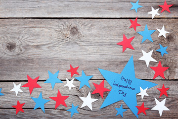 Paper star with inscription Happy Independence Day on wooden table