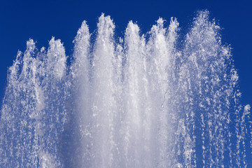 Top of the fountain . Drops of water fall down. 