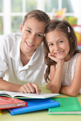 Brother and sister doing homework