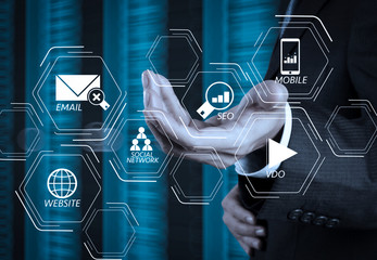 businessman hand  and server room background as concept