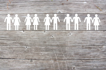 Gay lesbian and straight couples on wooden background