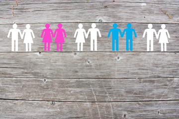 Gay lesbian and straight couples on wooden background