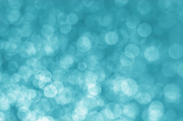 abstract aqua blue bokeh glitter sparkle background.