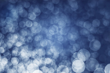 abstract blue bokeh glitter sparkle background.