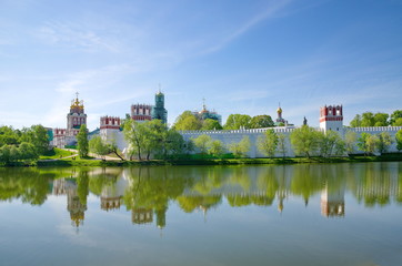 Fototapeta premium Panoramic view of the Novodevichy Convent, also Bogoroditse-Smolensky Monastery from the pond in Moscow city, Russia